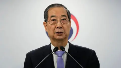 South Korea court reinstates PM as acting leader South Korea court reinstates PM as acting leader